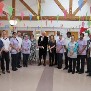 High Sheriff of Surrey presents prizes to staff